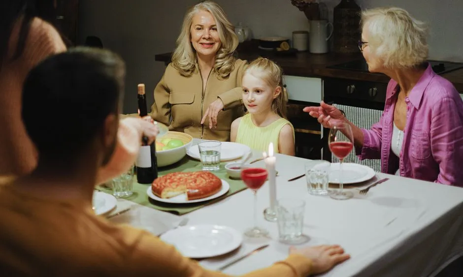 A multigenerational family sharing a warm dinner together
